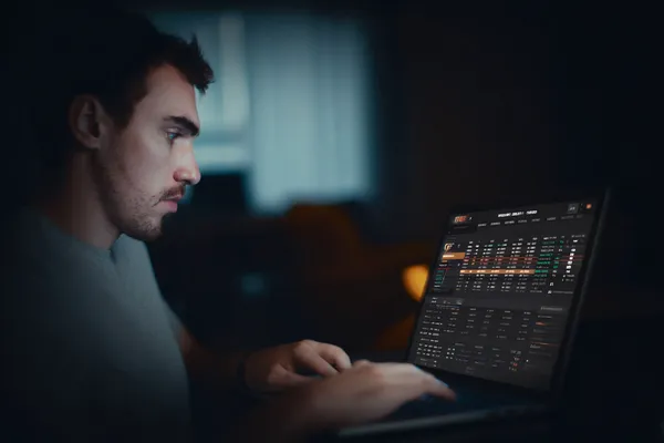 A cheerful woman in traditional clothing using her smartphone during a festive moment, showing how easily the 866JL app fits into everyday life.