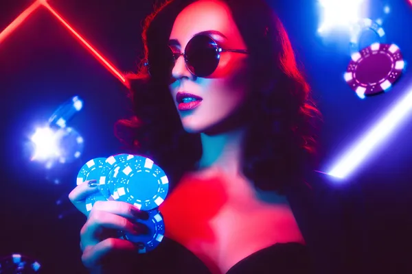 A player using their smartphone during a festive local event, representing 866JL’s fully mobile-friendly casino.